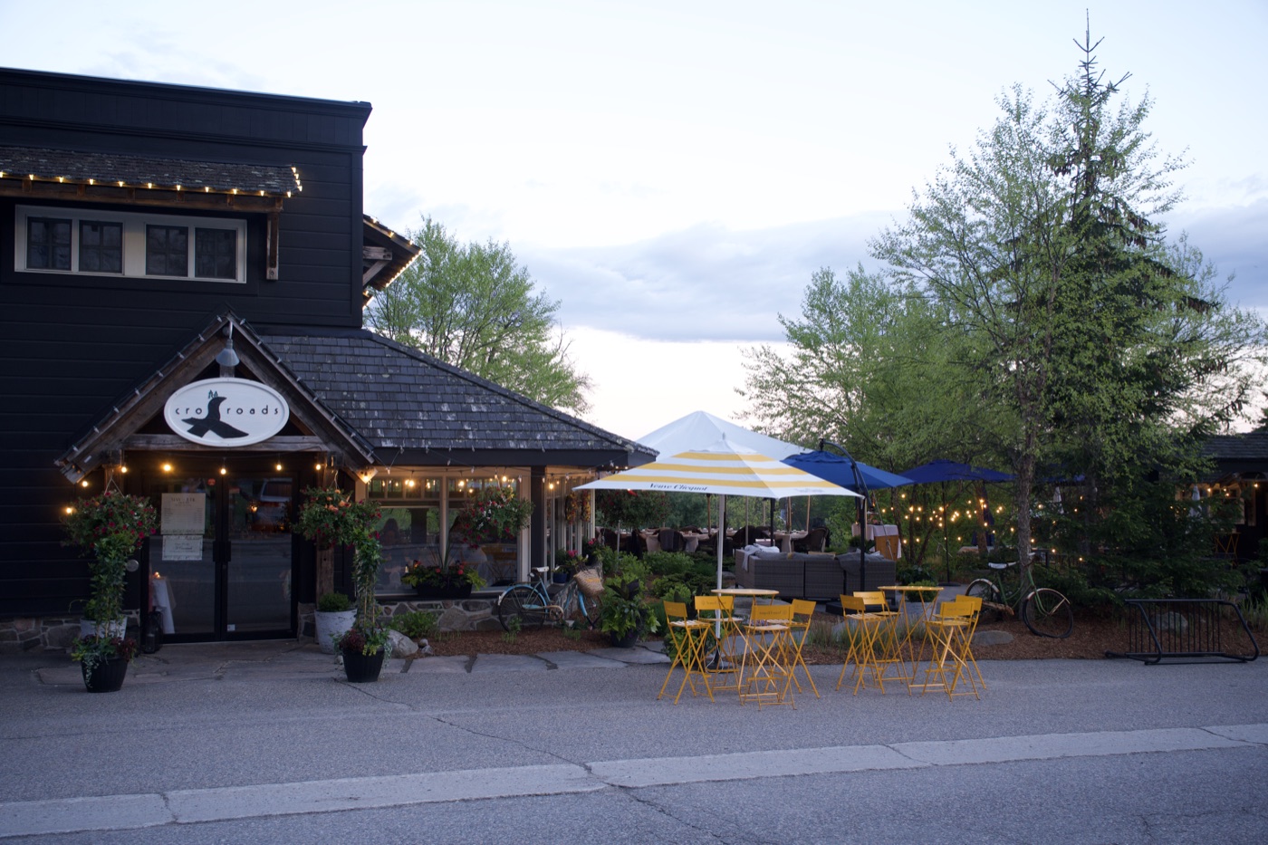 Crossroads restaurant exterior with patio seating in summer